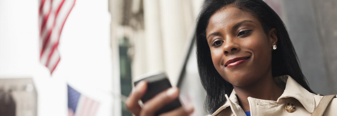 woman looking at cell phone