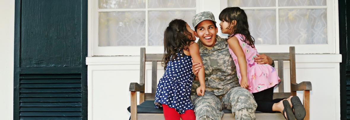 veteran family on bench on porch