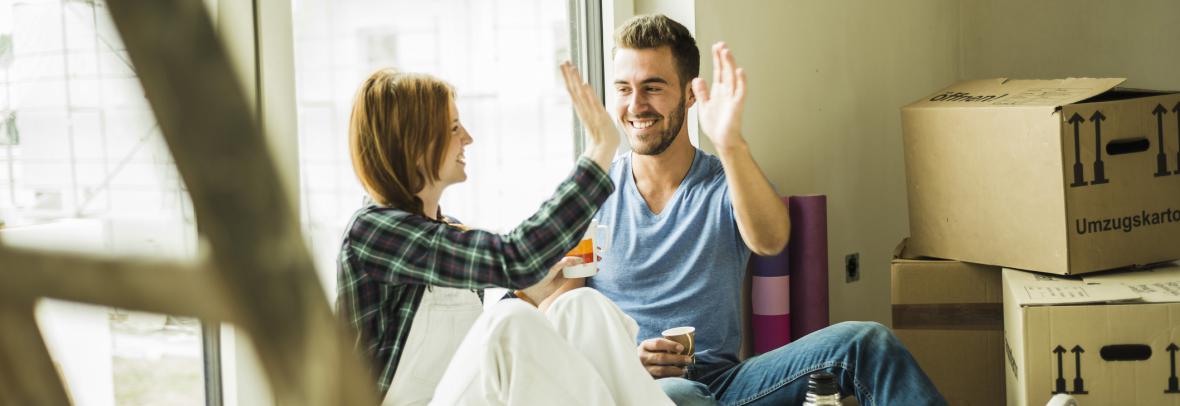 couple high-fiving renovation project