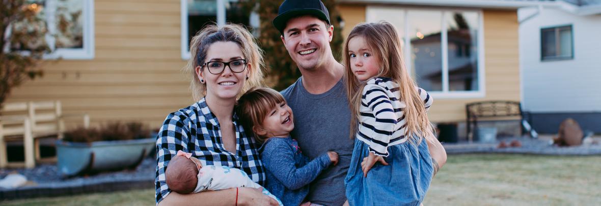 family outside a house