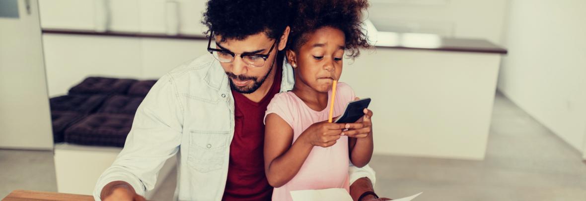 father daughter looking at financial paperwork