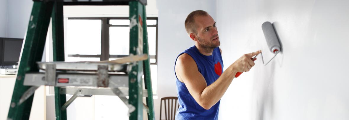 man painting a wall