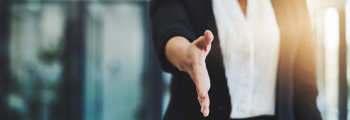 woman extending hand for handshake