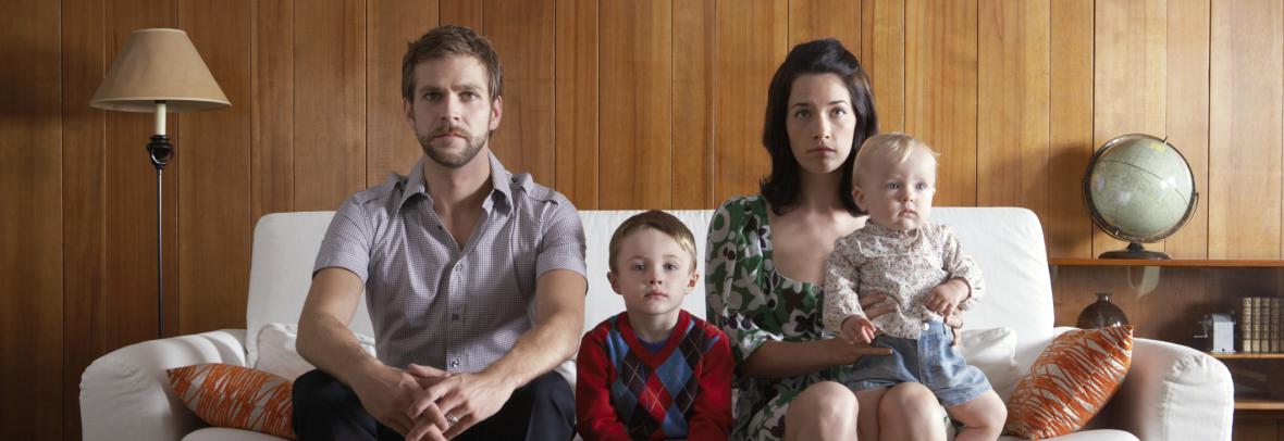 Parents and kids sitting on couch