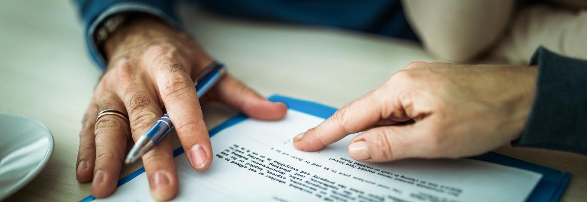 Hands on legal paperwork