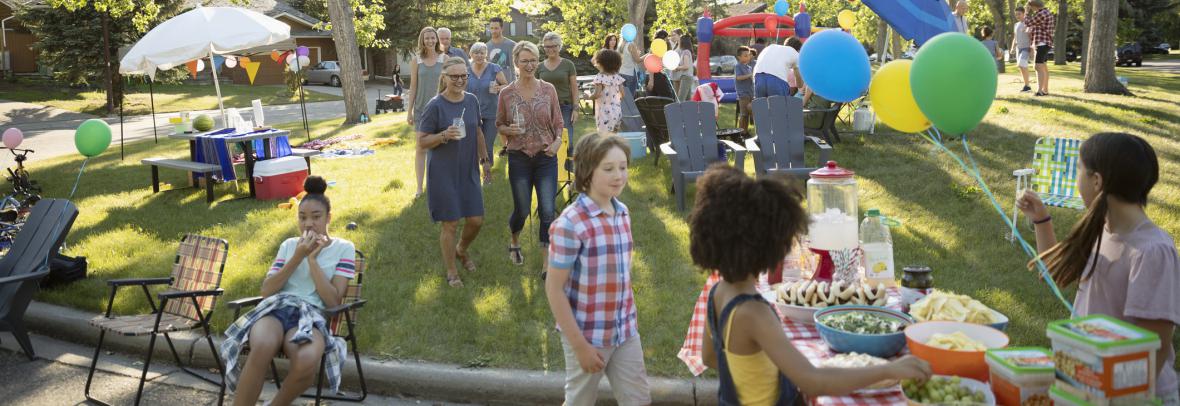 people attending a neighborhood street party