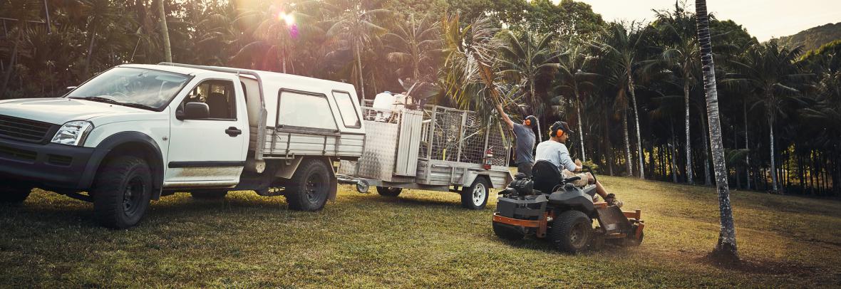 Two landscapers working together in a park