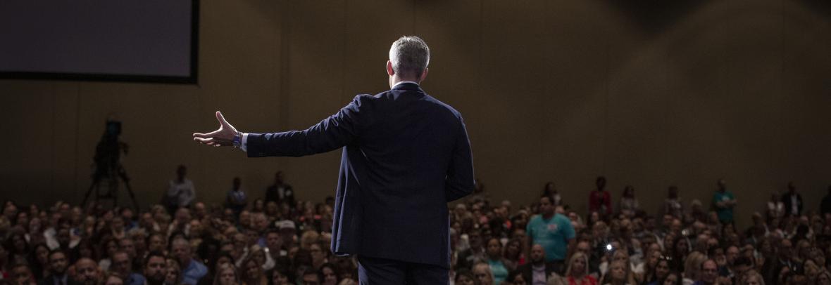 Man speaking on a stage