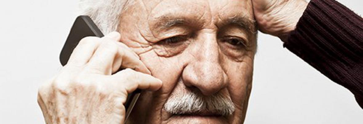 Older man is talking on a cellphone