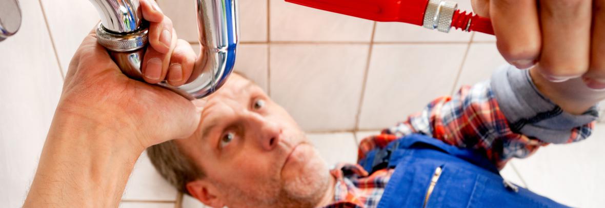 Man fixing plumbing
