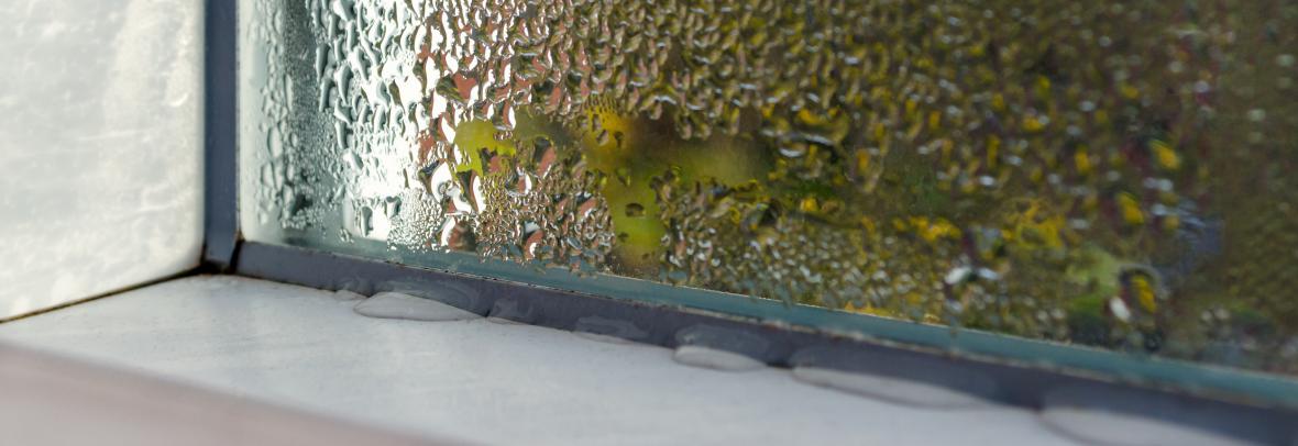 Corner of an outdoor window with a water leak