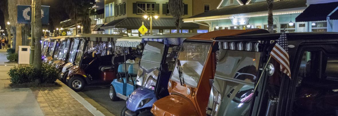 Electric carts parked along The Villages street