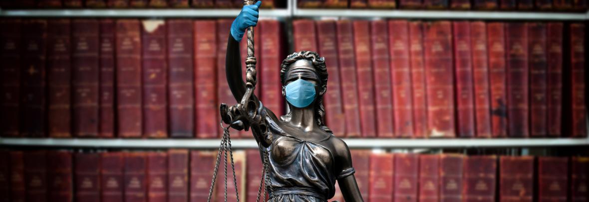 lady justice statue with face mask and gloves