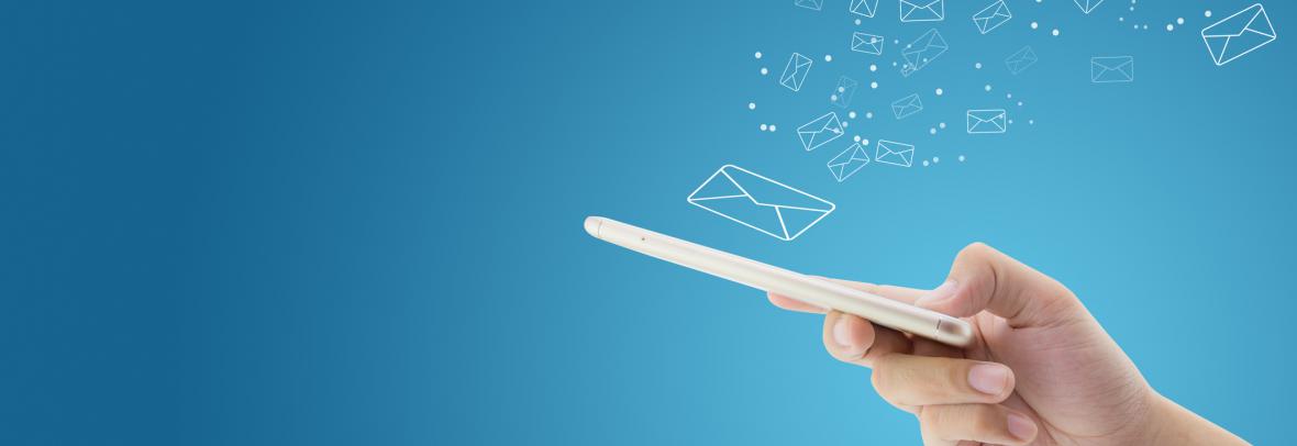 hand holding phone with drawings of envelopes floating