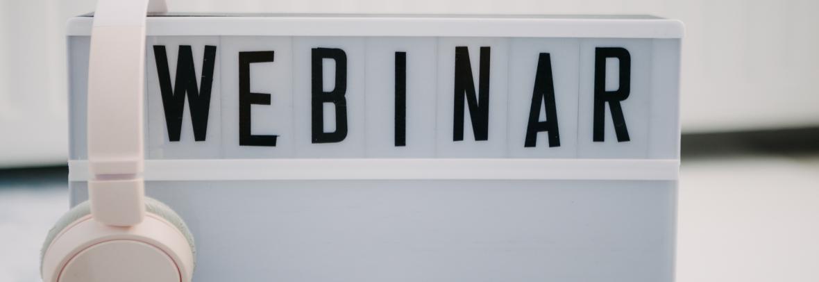 headphones on sign that says webinar