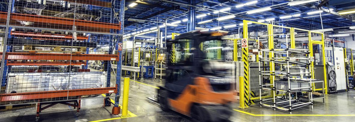 Inside of a large warehouse with stocked shelves for distribution