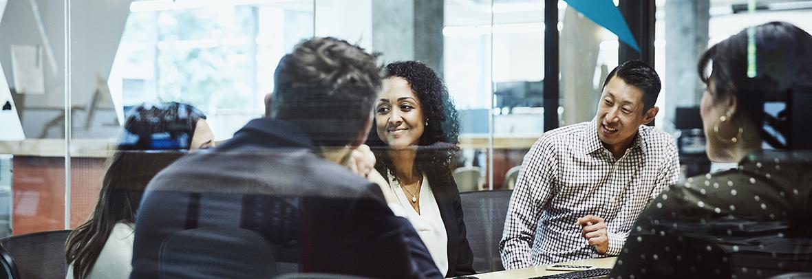 Photo of team of business people in a conference room