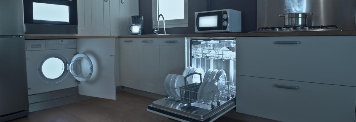 Kitchen with lights inside dishwasher, stove, washer and microwave