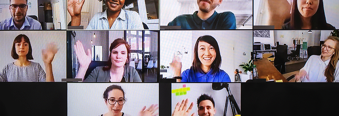 Photo of people waving a talking from their computers