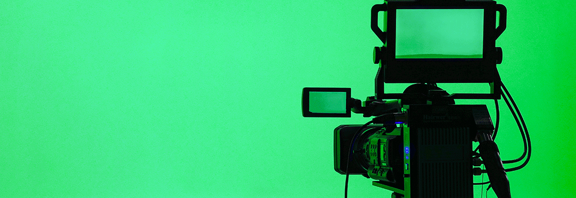 Image of a professional video camera on green background