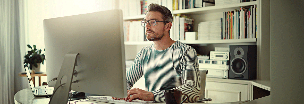 Photo of man working in home office space