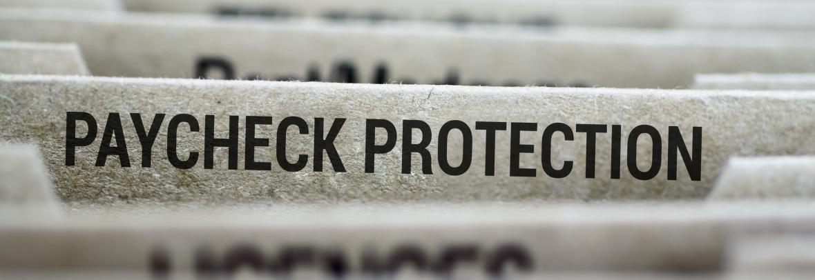 File folder with paycheck protection in focus