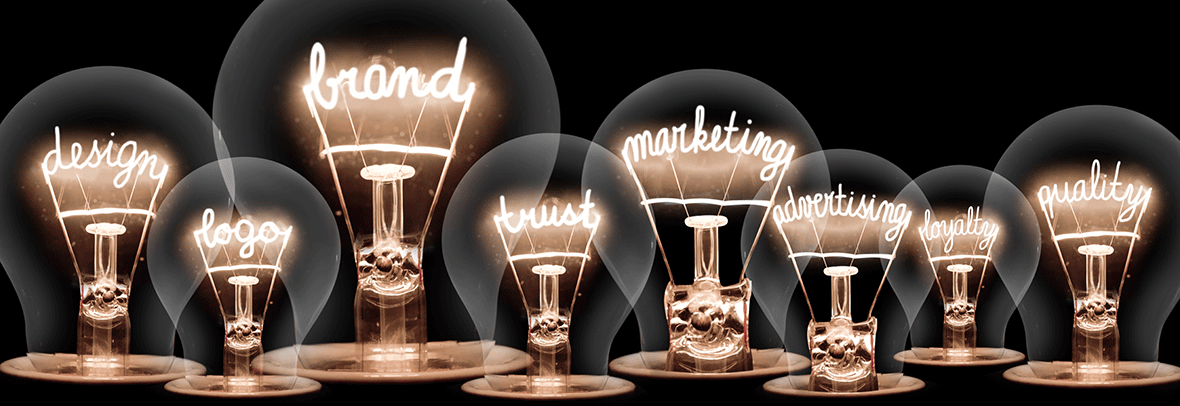 Photo illustration of lightbulbs with the words, brand, design, logo, marketing etc inside the bulbs