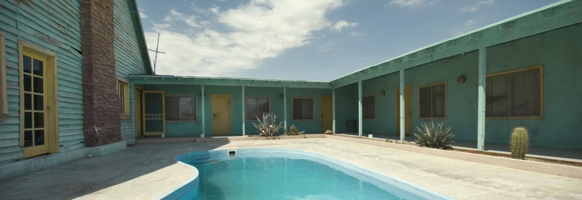 Older hotel with pool and no guests