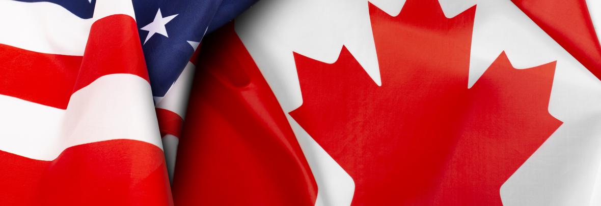 U.S. and Canadian flags folded to show maple leave and stars