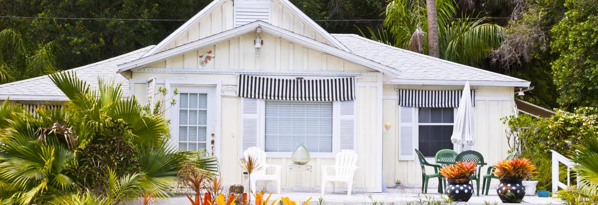 Older Florida home updated with paint and landscaping