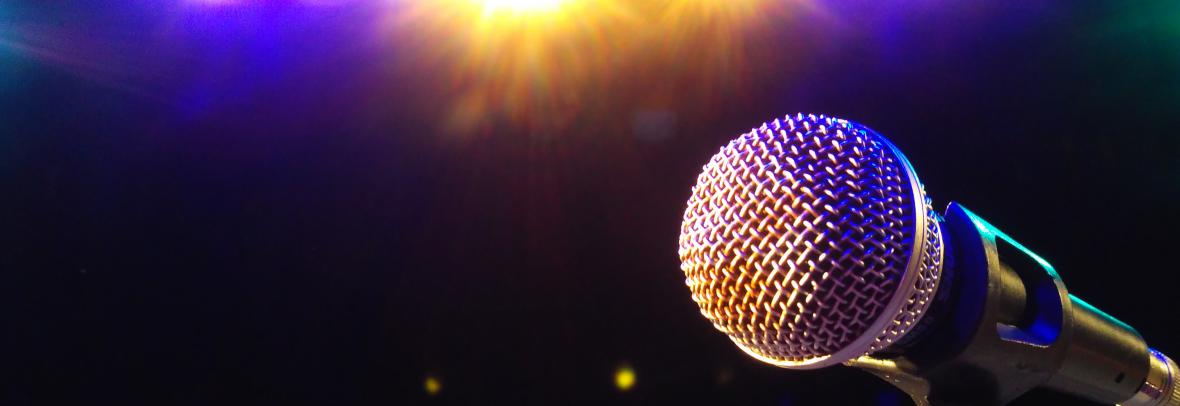 Microphone illuminated in spotlight