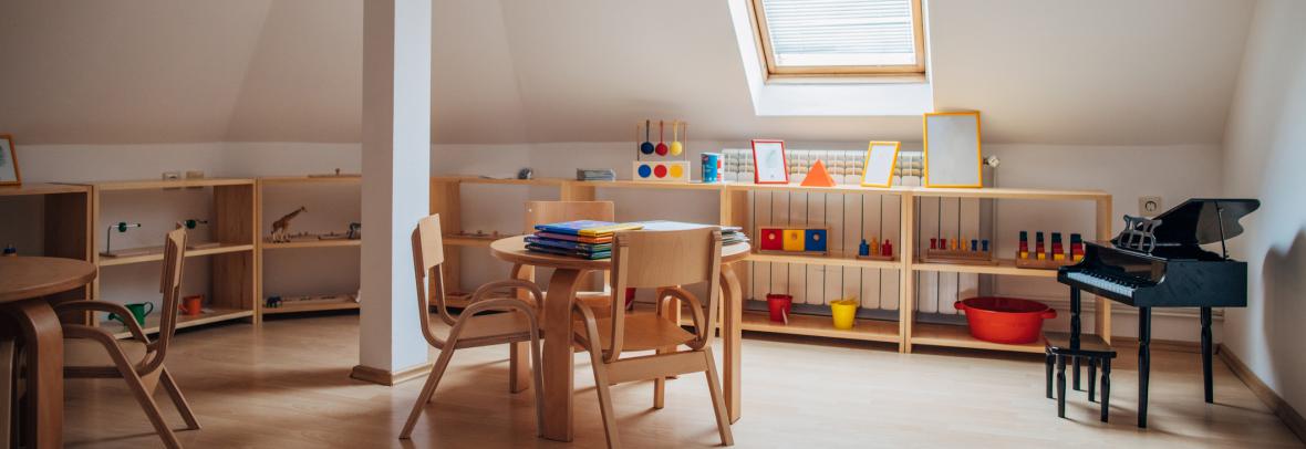 Table and desk in a top floor room used for teaching from home