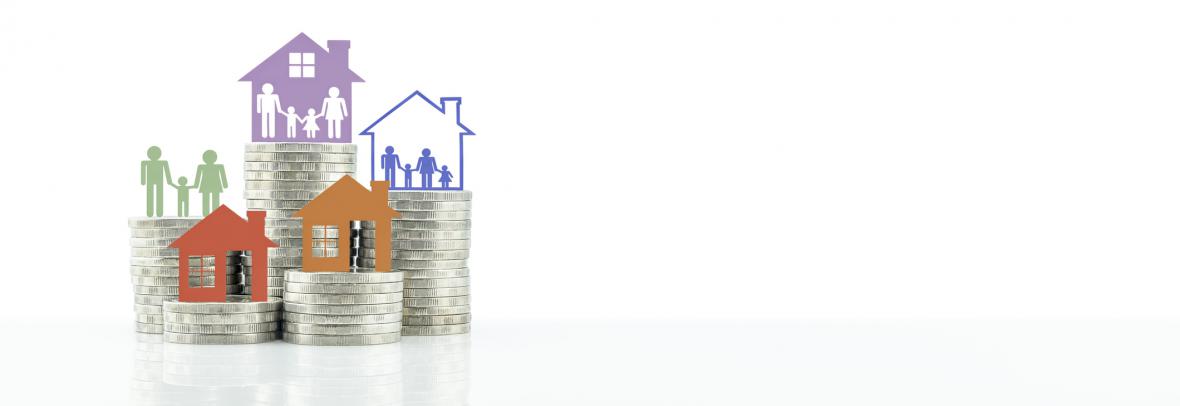 Home and family cutouts sit on top of coins stacked at different heights