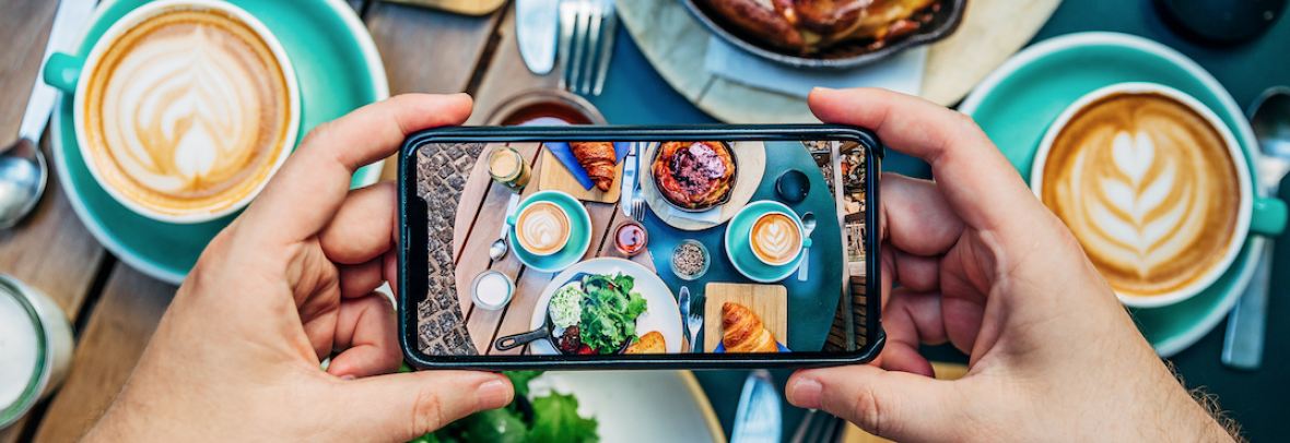 Cellphone taking a picture of food for Instagram