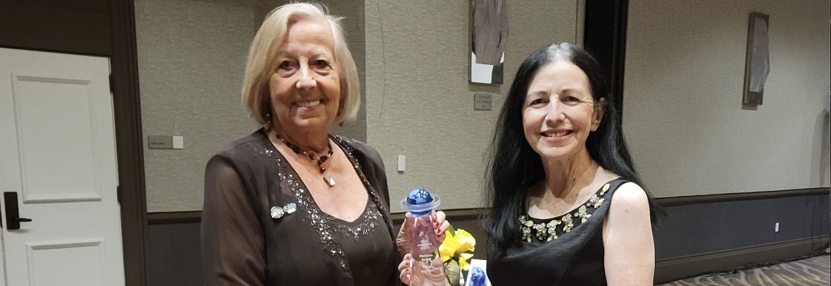 Christel Silver and Maria Grulich hold NAR's Global Platinum Award