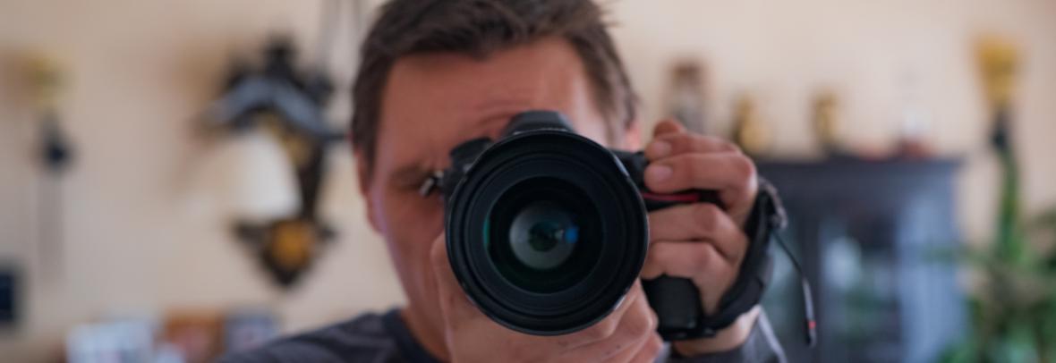 Camera faced toward viewer with living room in background
