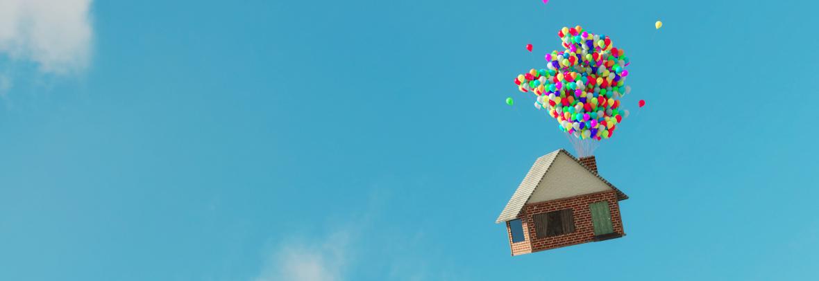 House floating in the sky and held up by balloons