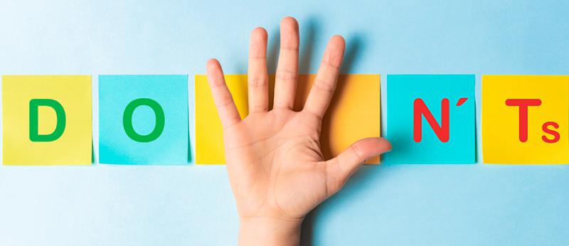 Photo illustration of a hand that divides the words Do and Don't