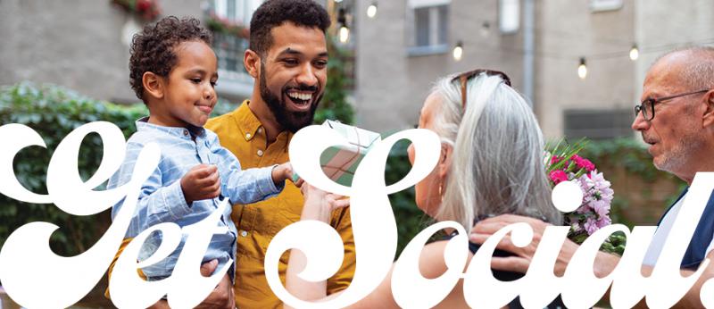 Photo of a group of people celebrating with the words Get Social! over it.
