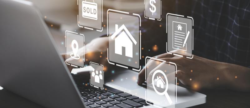 laptop with real estate illustrations