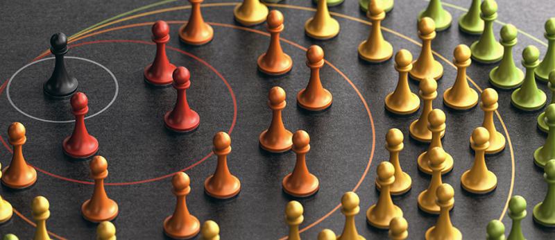 Photo illustration of chess pieces in a cascading shape from the center piece