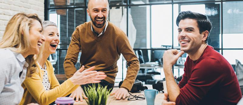 coworkers enjoying a business meeting around a table