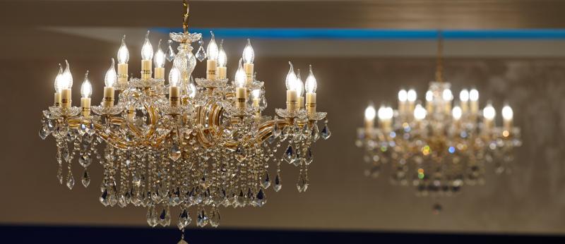 A large crystal chandelier with lights on