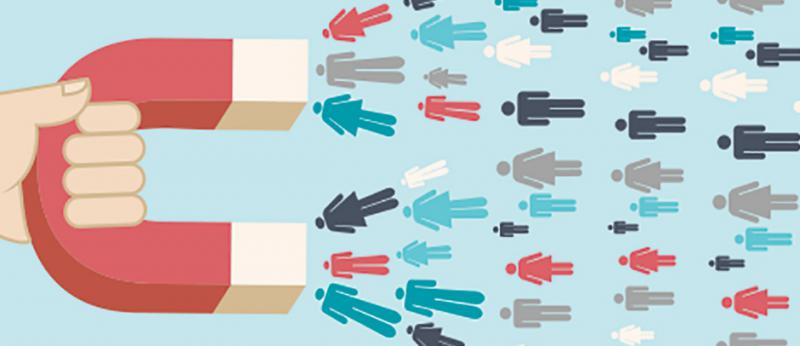illustration of a hand holding a magnet drawing people in