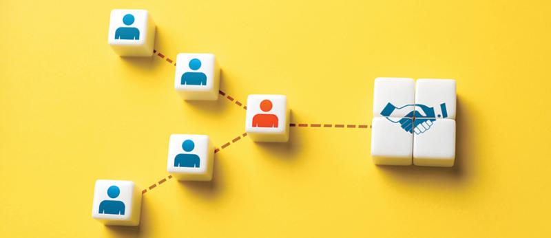 photo illustration of squares with people shapes on them coming together at one square representing the mediator