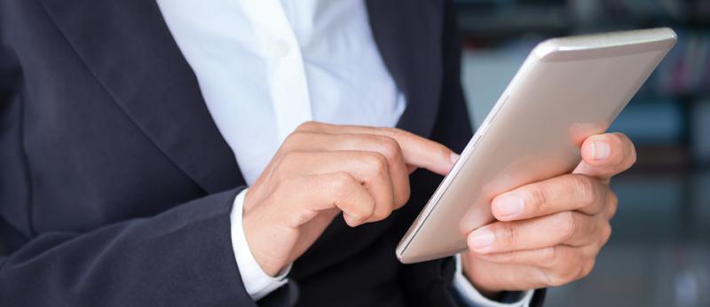 business woman's hands holding a smartphone