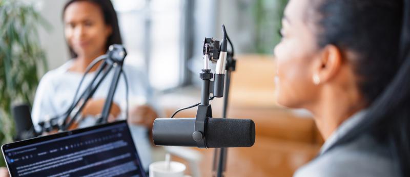 Two women in live podcast
