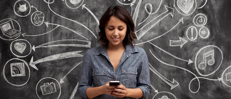 photo of woman infront of a chalkboard with social media symbols
