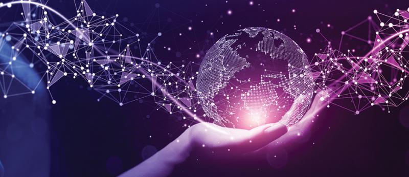 Digital illustration of a hand holding a globe with pink and purple data points emanating from it.