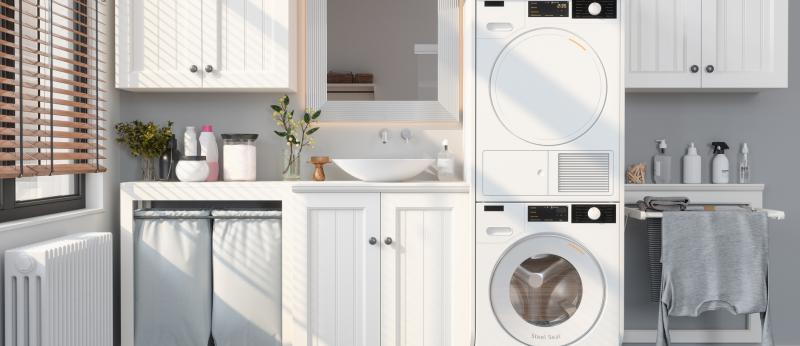 Modern Laundry Room With Washing Machine, Dryer, White Cabinets and Drying 